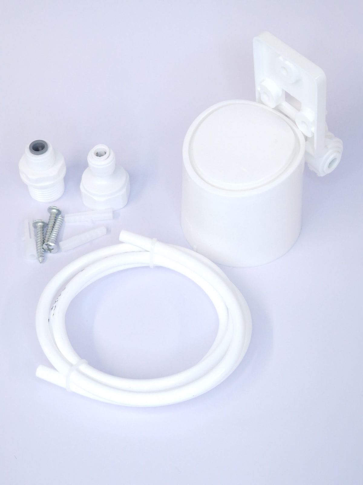 Replacement filter parts set with white housing, tubing, and small fittings