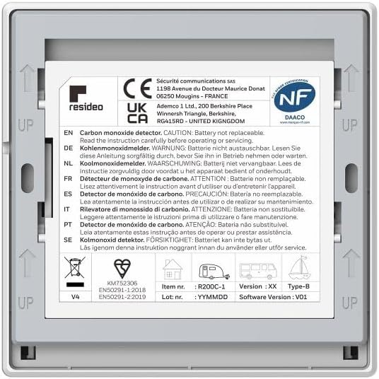 White carbon monoxide detector backing with regulatory label and device information