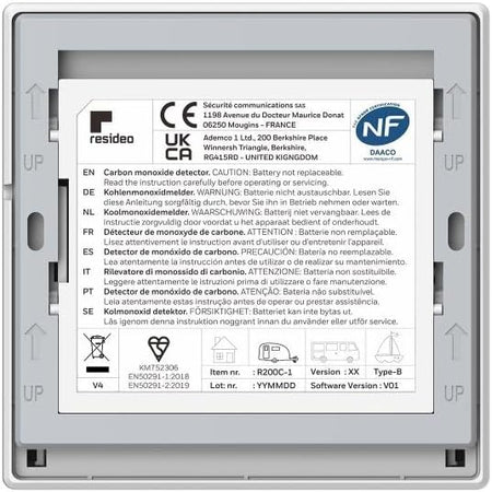 White carbon monoxide detector backing with regulatory label and device information