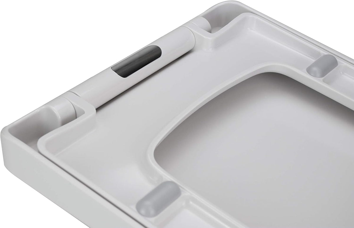 White toilet seat lid close-up with molded grip handles and soft-close hinges