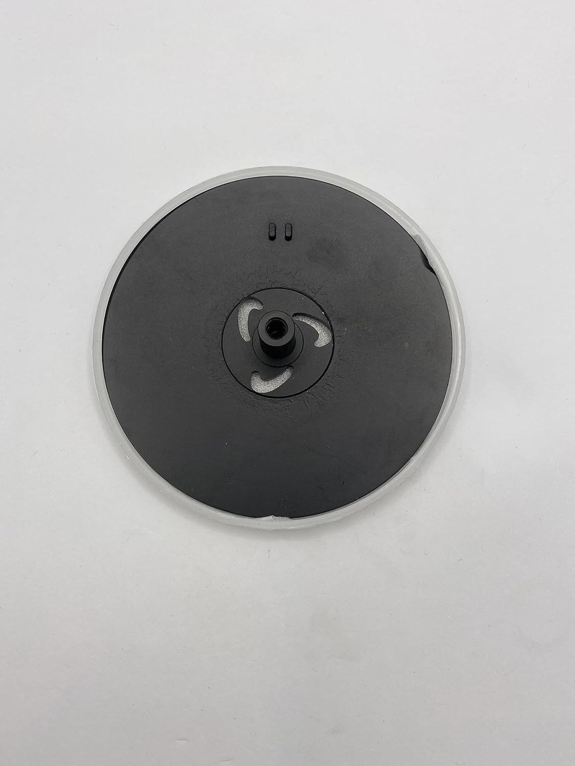 Matt black round waste cover with center valve outlet and mounting tabs