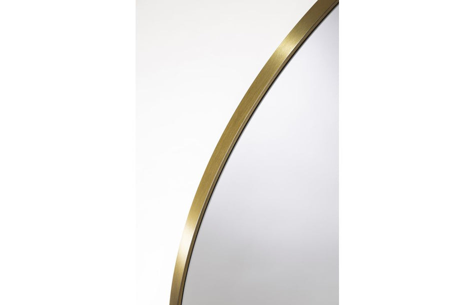 Brushed brass mirror frame edge detail with smooth rounded profile