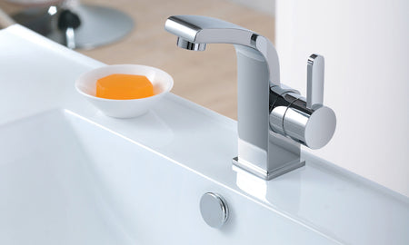 Chrome single-lever basin mixer tap with tall spout and round handle