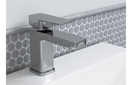 Chrome deck-mounted basin mixer tap with rectangular spout and single lever