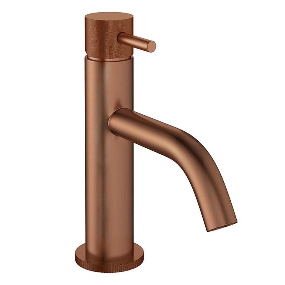 Brushed bronze basin mixer tap with tall cylindrical body, lever handle, and curved spout