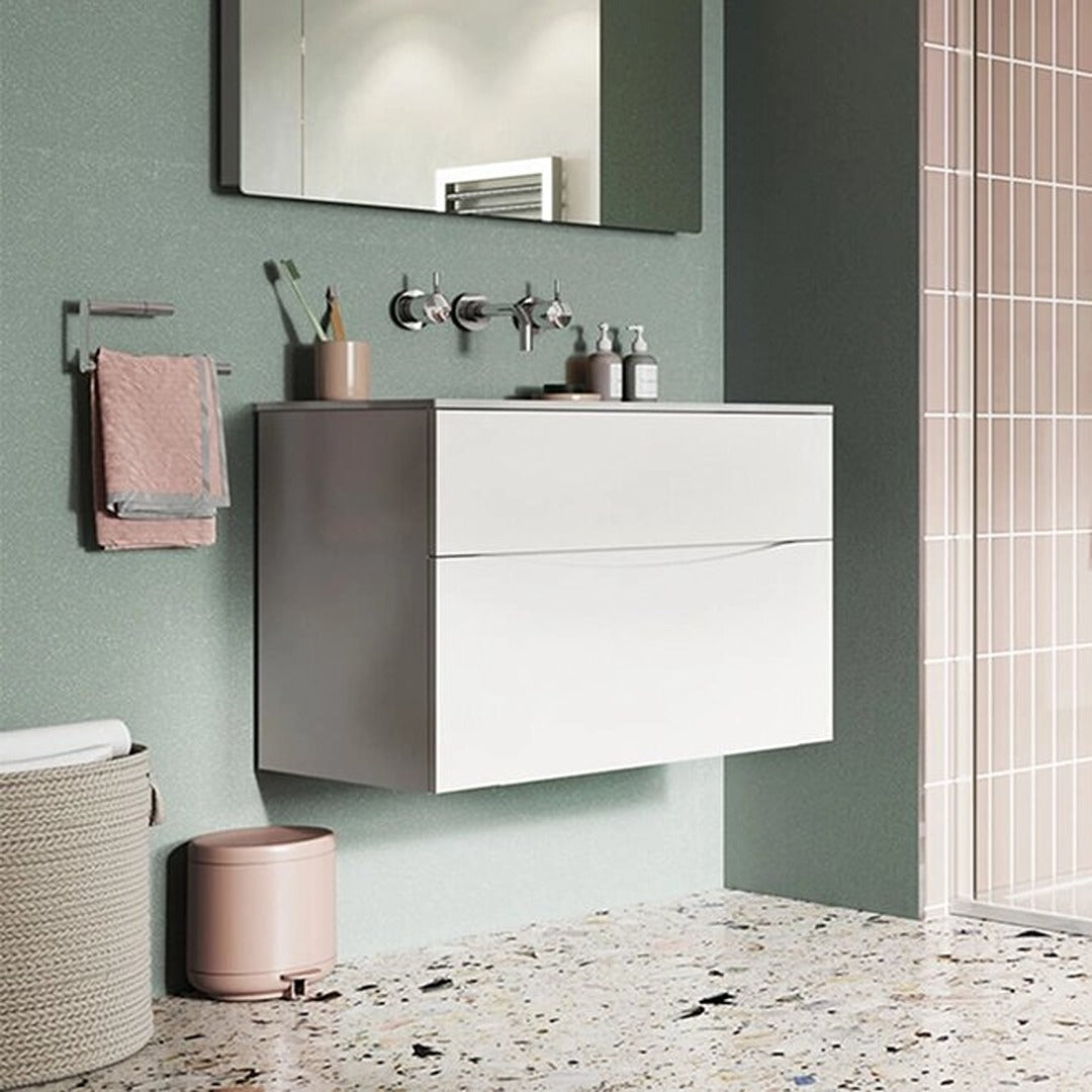 Wall-mounted basin mixer with twin lever handles and curved spout above sink