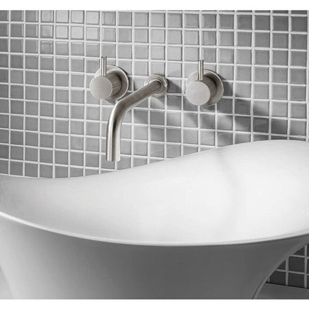 Wall-mounted basin mixer with twin lever handles and curved spout, chrome finish