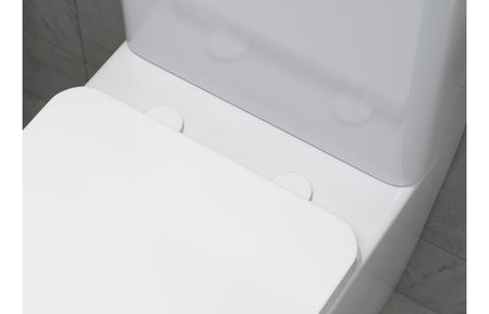 White toilet seat cover caps on toilet rim, round caps with mounting holes