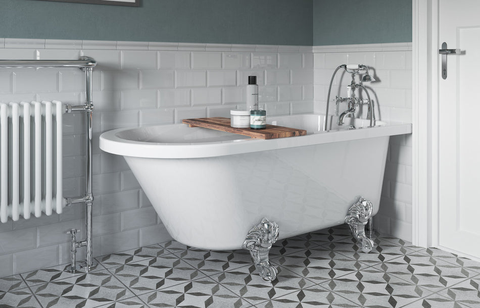 White freestanding corner bath with chrome claw feet, visible rim and interior