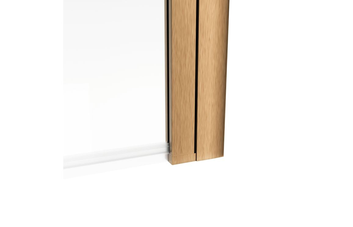 Bath screen glass panel with brushed bronze side frame, straight edge view