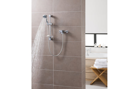 Chrome thermostatic mixer shower with water spray from overhead and hand shower