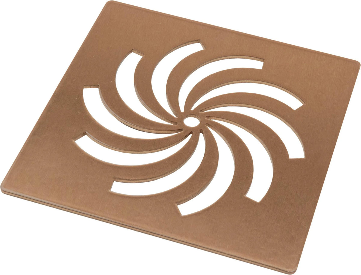 Brushed bronze metal waste cover with circular swirl cutout design