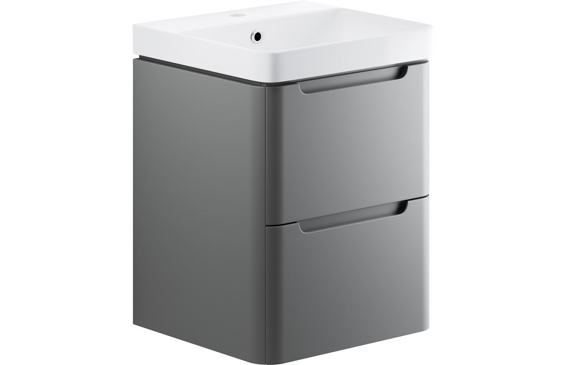 Matt gray 2-drawer basin unit with curved white ceramic basin and recessed handle drawers