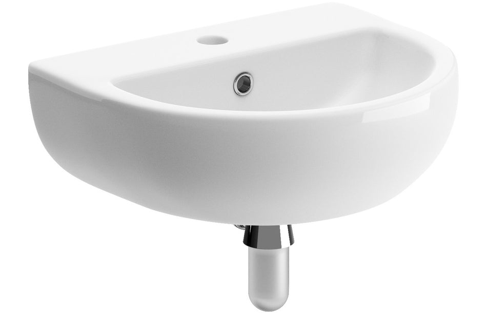 White cloakroom basin with chrome bottle trap and overflow hole