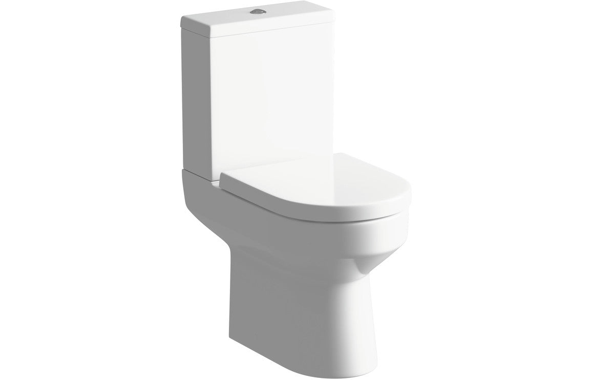 White close-coupled rimless toilet with open back pan and soft-close seat