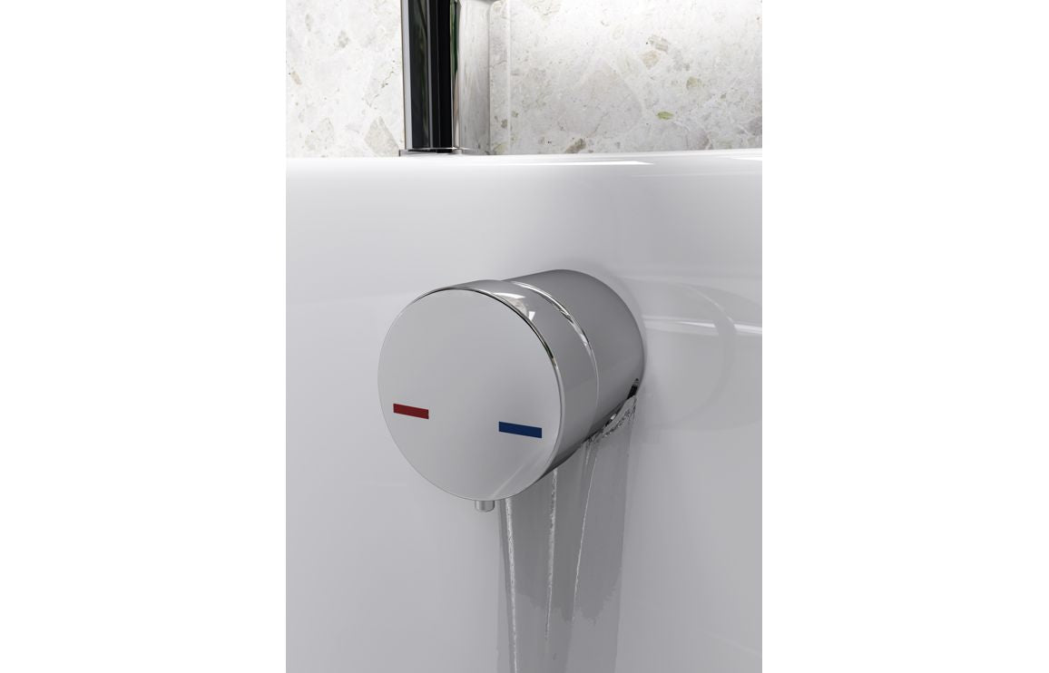 Bath overflow filler with integrated valve, chrome round control and outlet