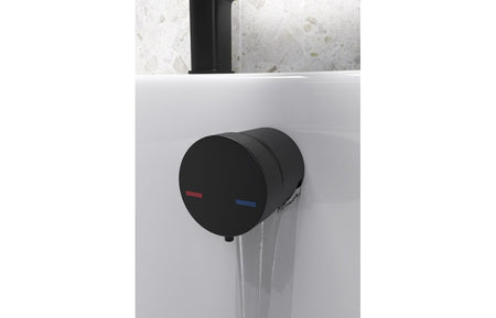 Black overflow filler with integrated valve and circular cover for bathtub overflow outlet