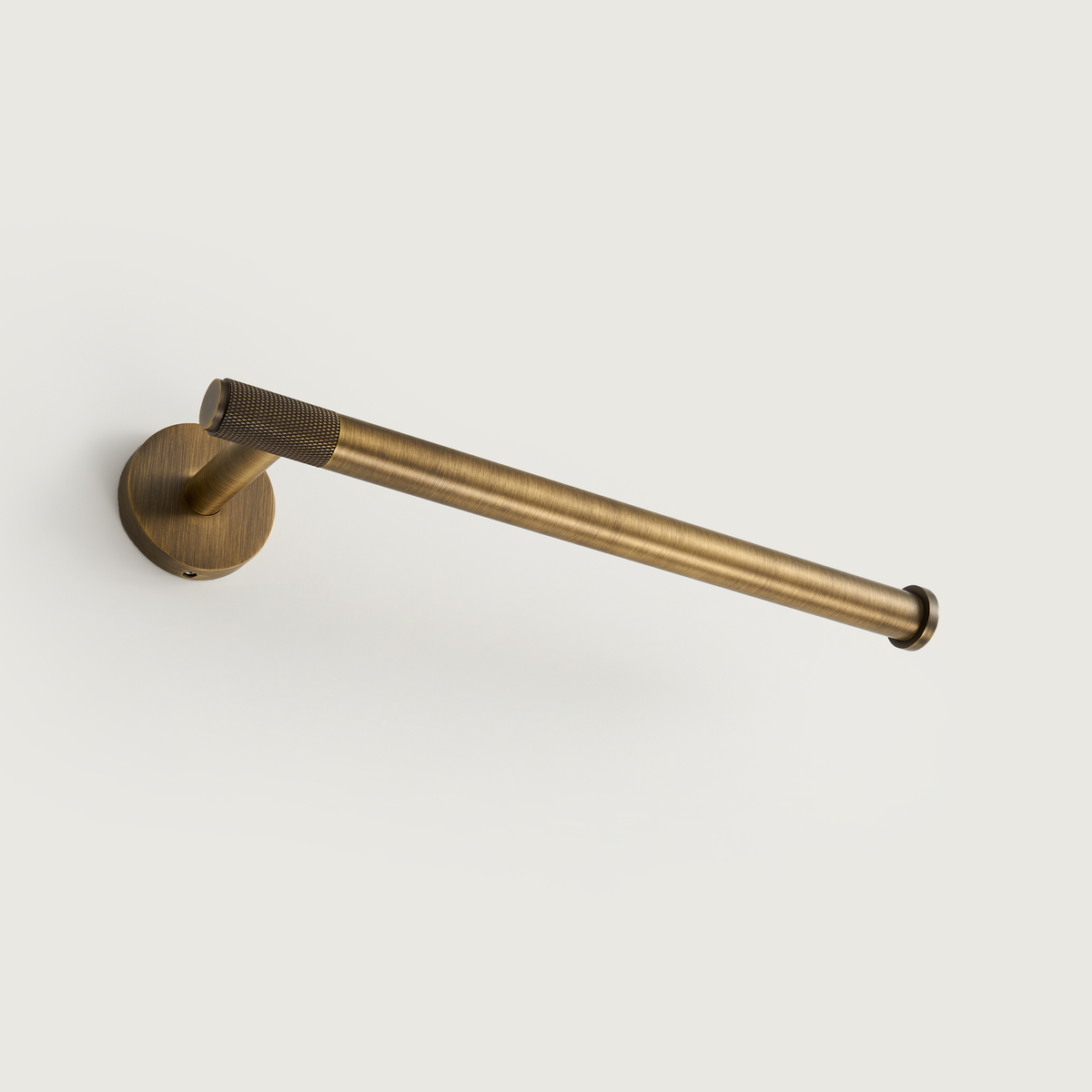 Brushed brass towel rail with circular mounting plate and smooth end tube