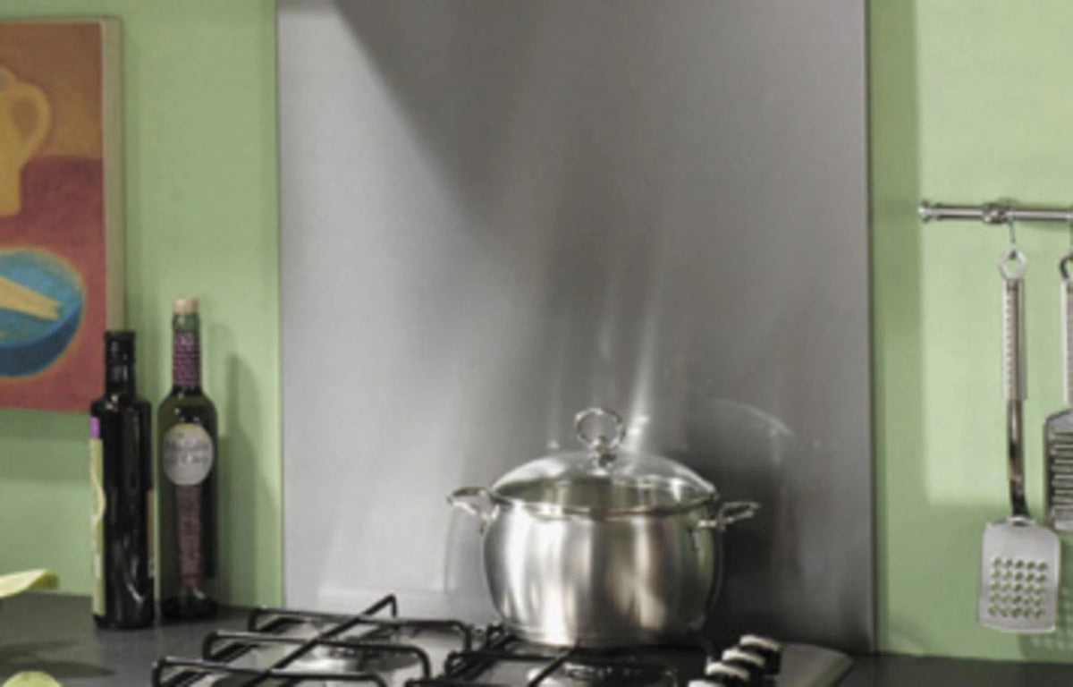 Brushed stainless steel kitchen splashback panel behind stove