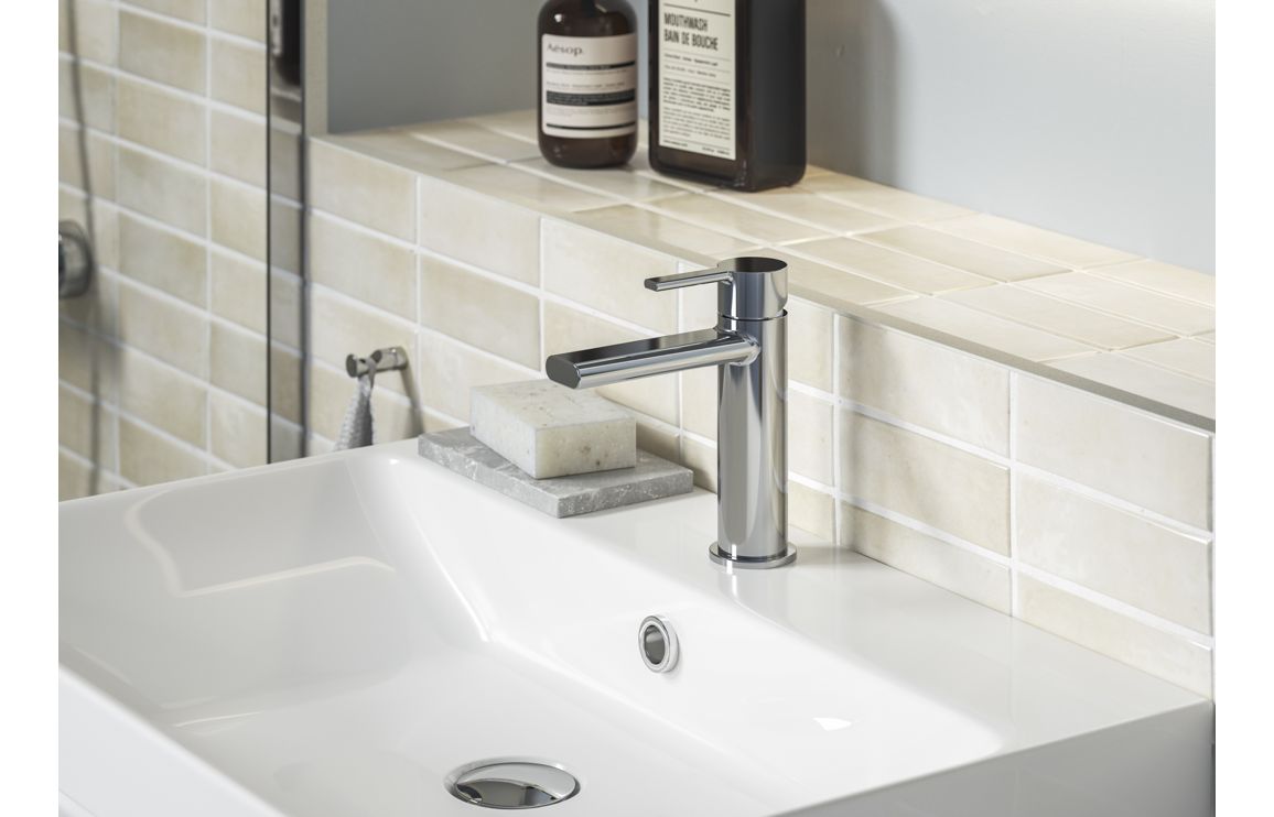 Chrome deck-mounted mixer tap with handheld shower hose and holder