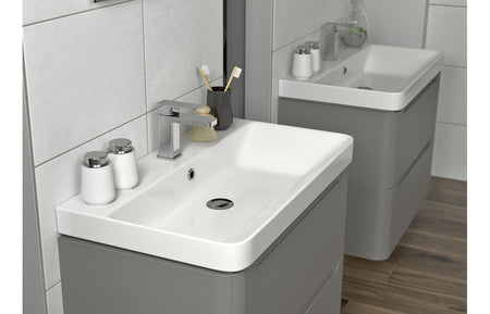 Matt gray 2-drawer bathroom basin unit with curved white ceramic sink and tap hole