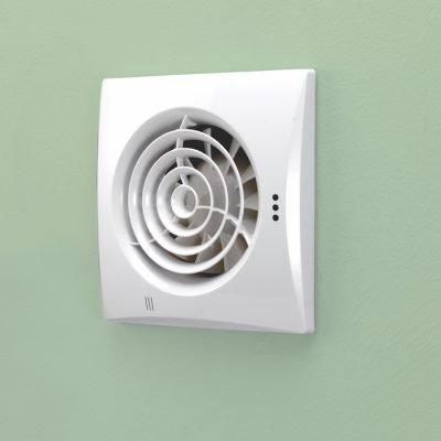 Wall-mounted extractor fan with timer, white housing and circular black fan grille