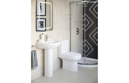 White open-back close-coupled toilet with soft-close seat, side angle view