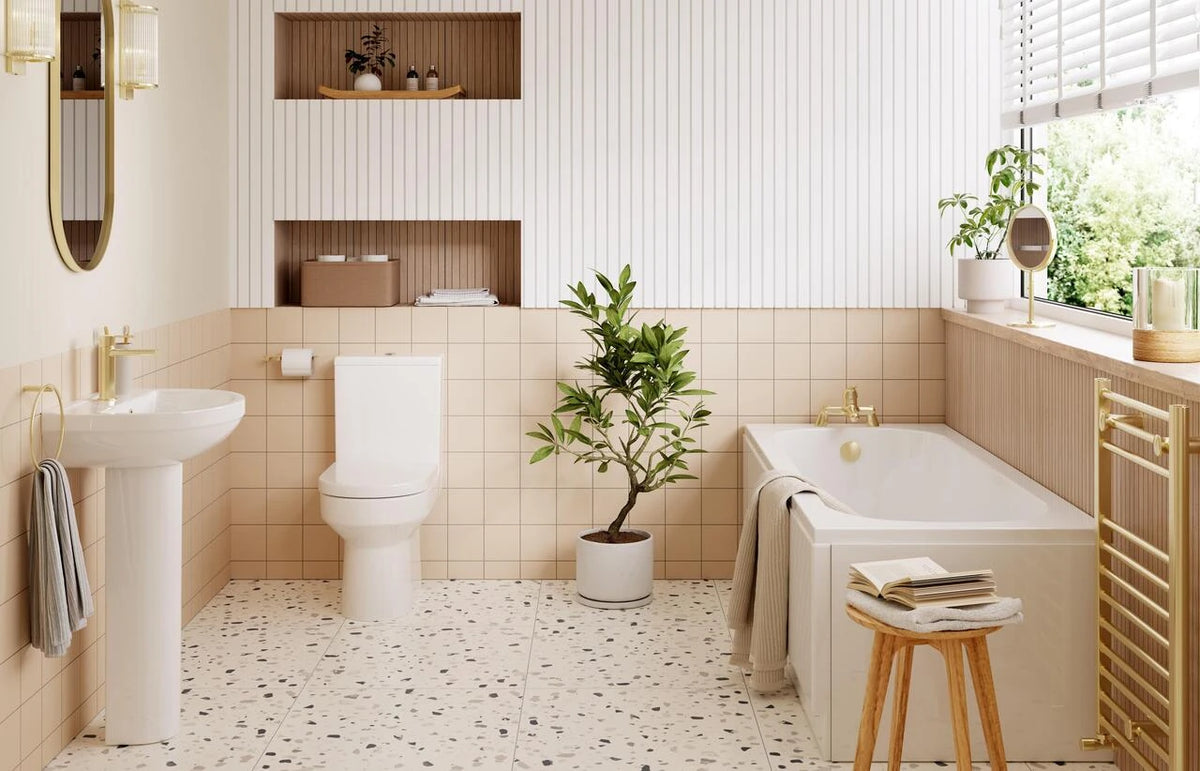 White vanity and close-coupled toilet in a bright bathroom interior