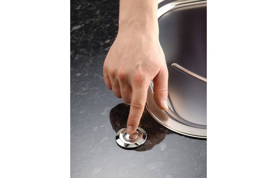 Multi Air Switch with round chrome button on kitchen sink countertop