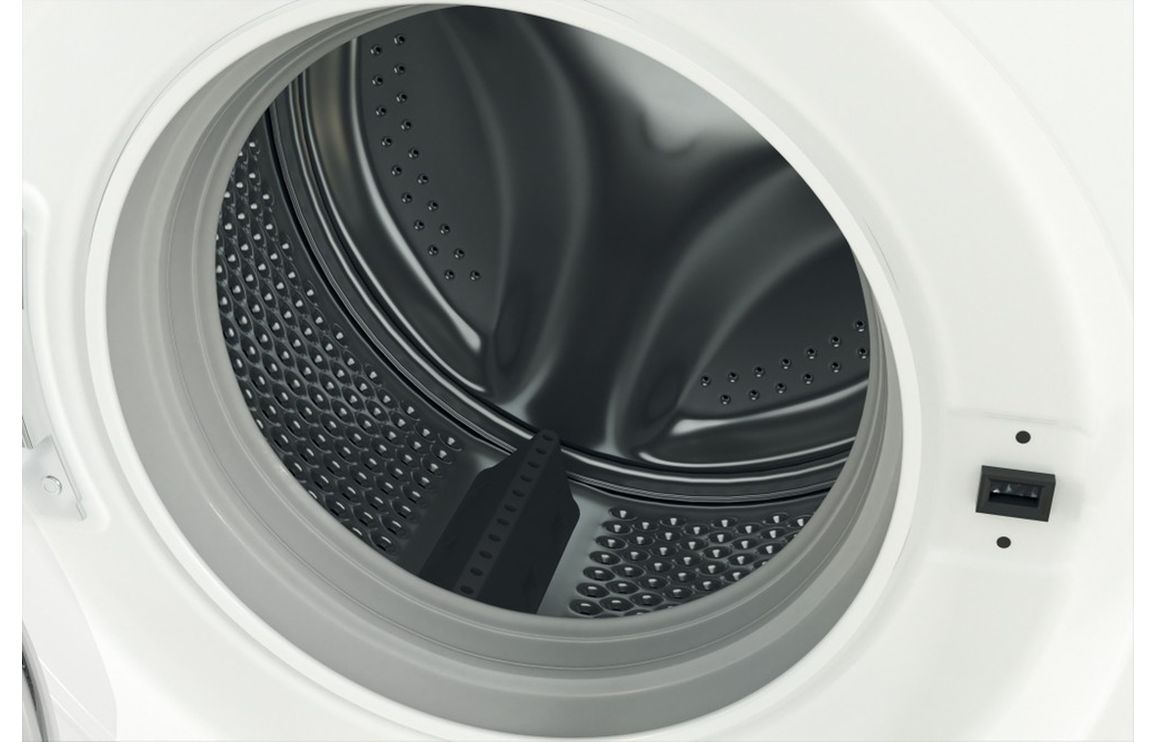 Washing machine door close-up with visible drum and perforated metal tub
