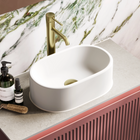 White oval vessel bathroom basin with smooth rounded rim