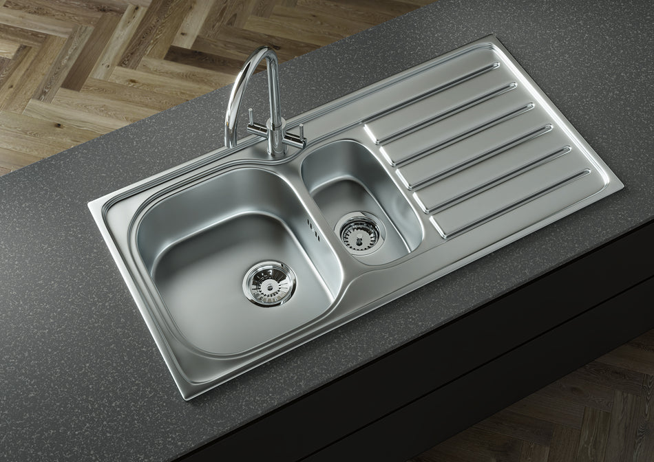 Stainless steel double-bowl kitchen sink with ribbed draining board and two drain strainers