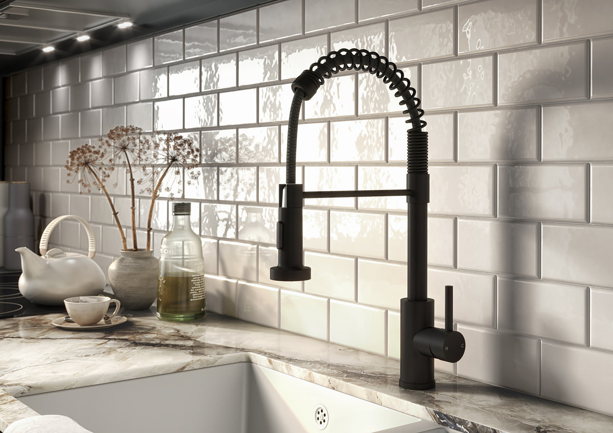 Black kitchen mixer tap with pull-out spray hose and side lever handle