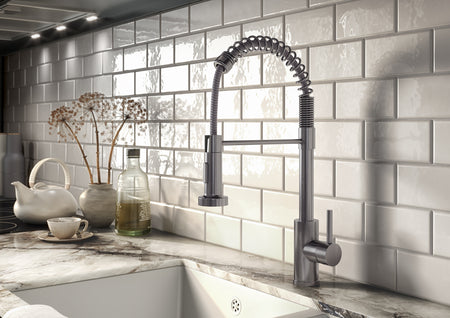 Stainless steel kitchen mixer tap with pull-out spray hose and lever controls