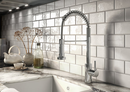 Chrome kitchen mixer tap with pull-out spray hose and lever handle
