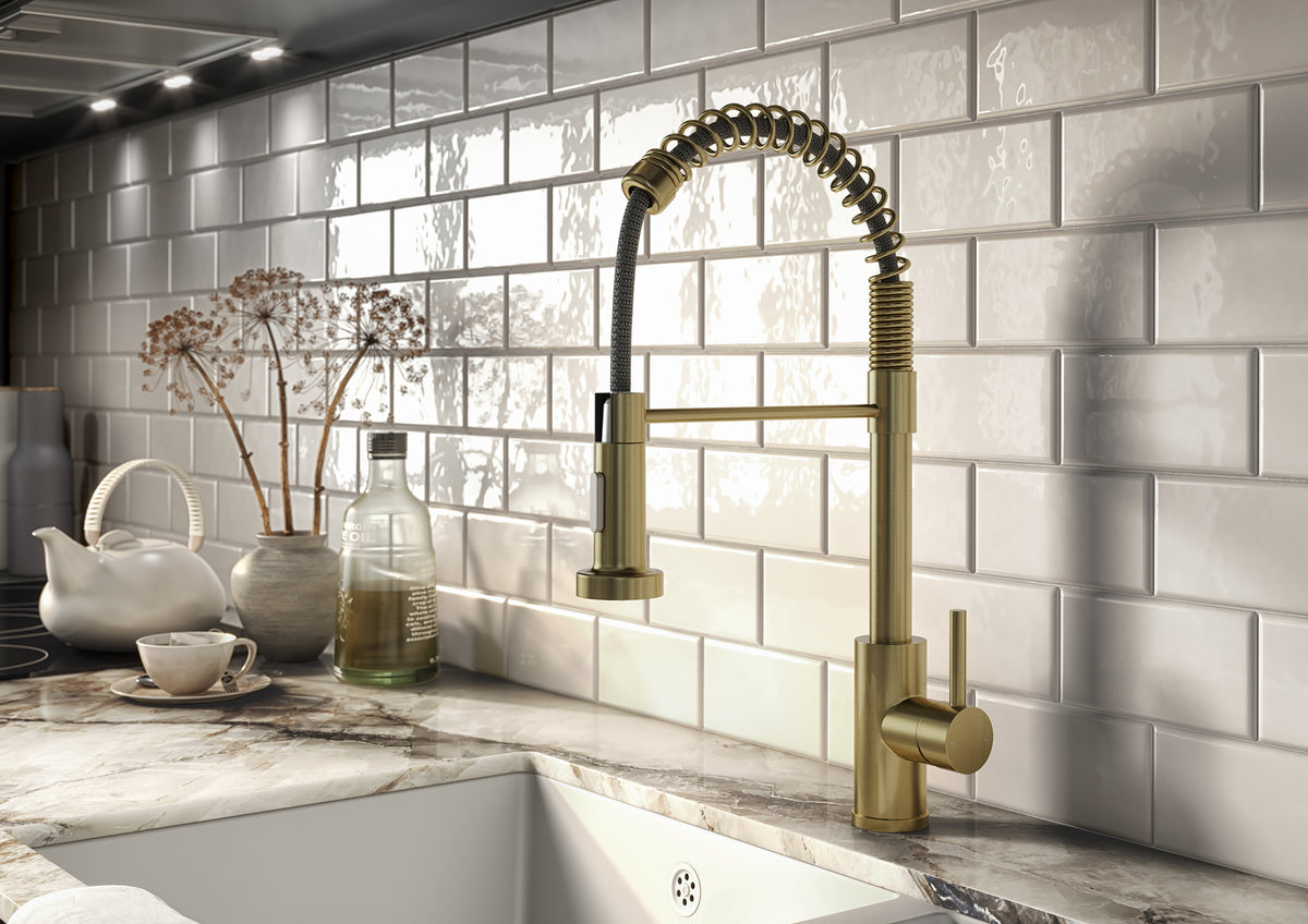 Brass kitchen mixer tap with pull-out spray hose and matching lever handle