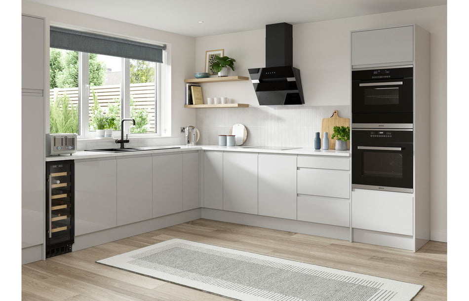 Built-in under-counter larder fridge in kitchen cabinetry, white finish