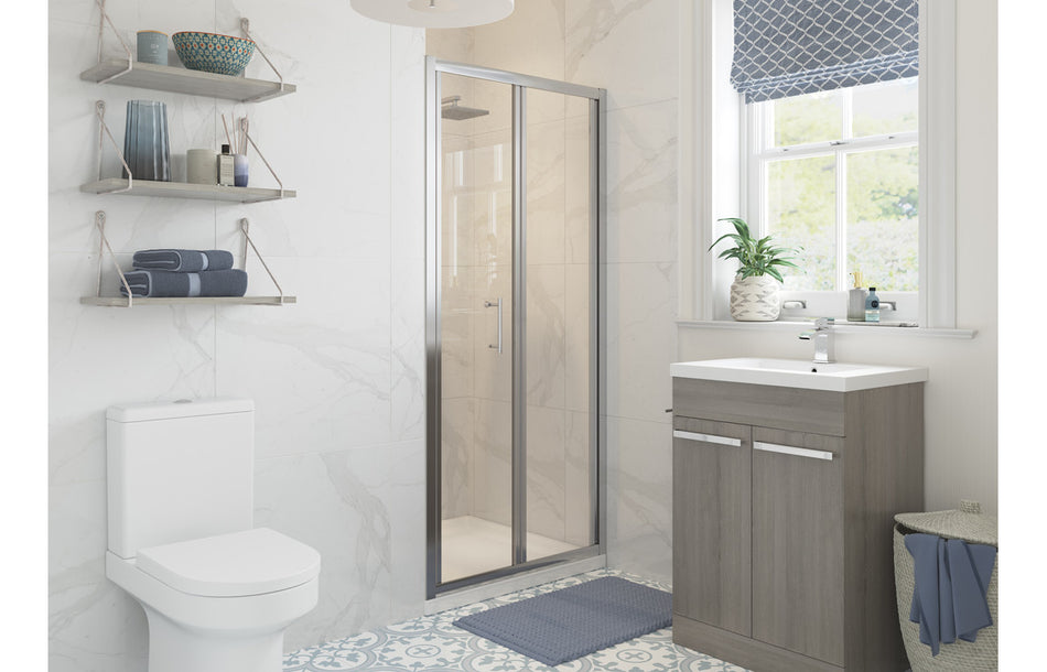 Bi-fold chrome shower door with clear 5mm glass, recessed fit, wall-mounted frame