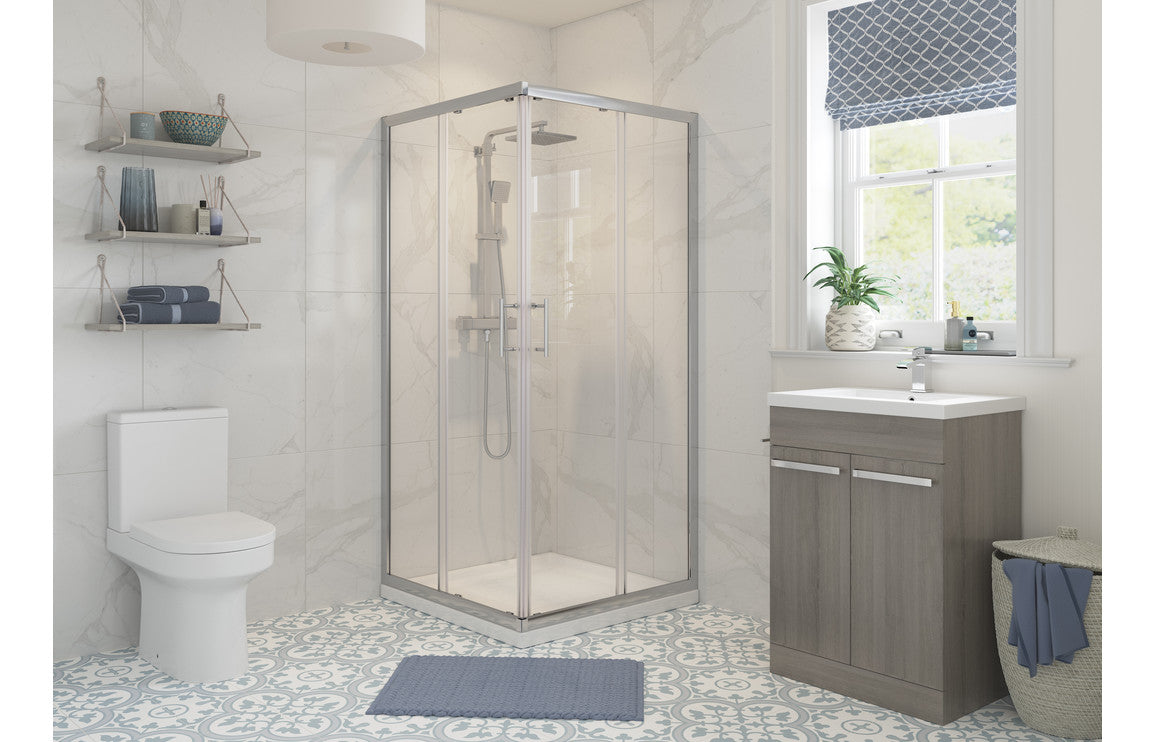 Chrome corner shower enclosure with clear glass panels and sliding entry door