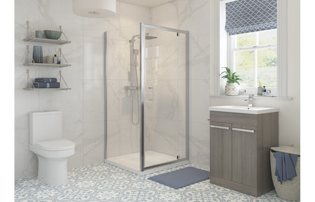 Chrome framed clear glass shower enclosure with hinged door and side panel