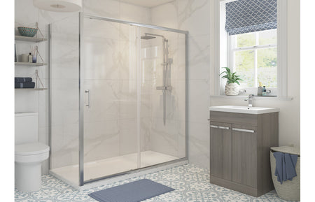 Chrome framed hinged clear glass shower door and side panel, glass enclosure