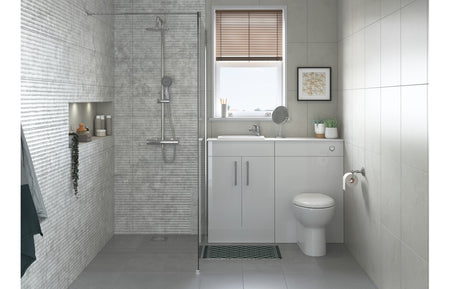 White close-coupled toilet with open back soft-close seat, corner view
