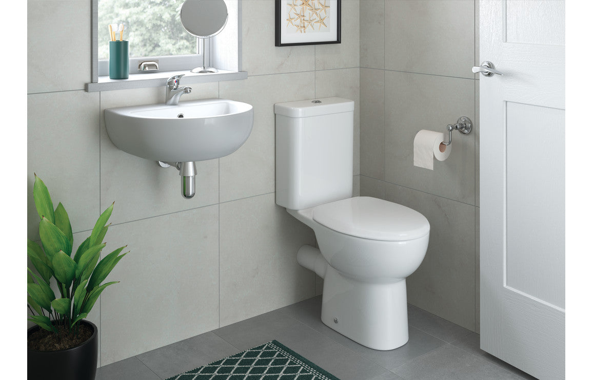White close-coupled toilet with open back soft-close seat, bathroom installation