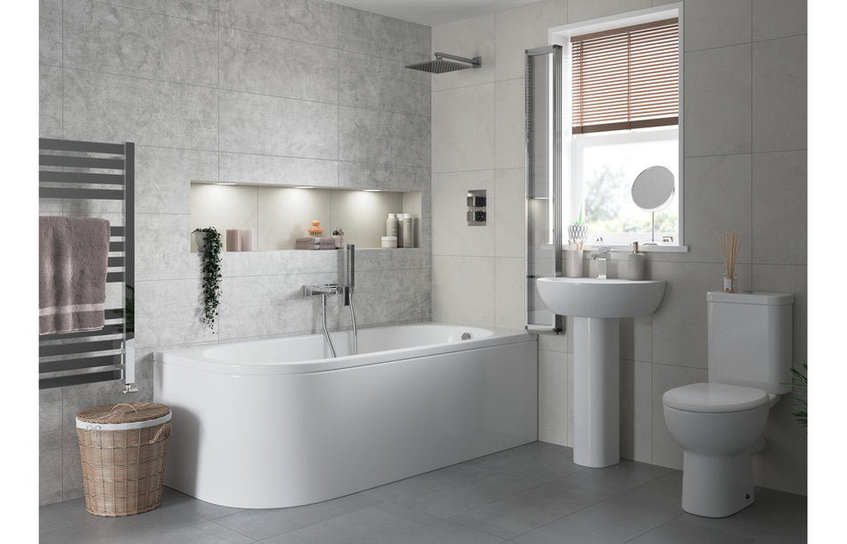 White close-coupled toilet with open back soft-close seat, side view