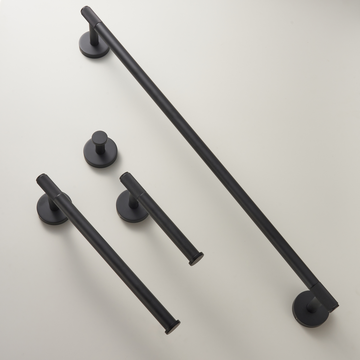 Matte black wall accessories set with towel rails and small round mounting bases