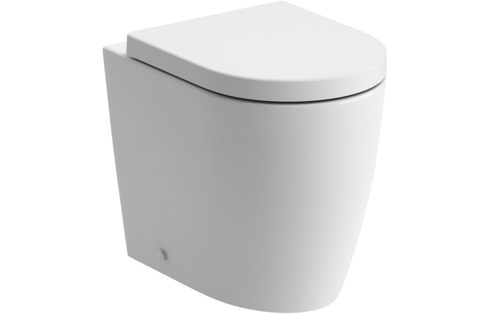 Back-to-wall white toilet with soft-close seat, closed lid