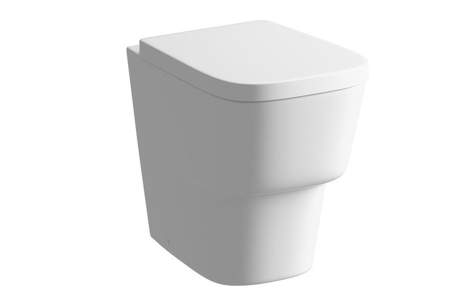 White back-to-wall toilet with soft-close seat, angled view