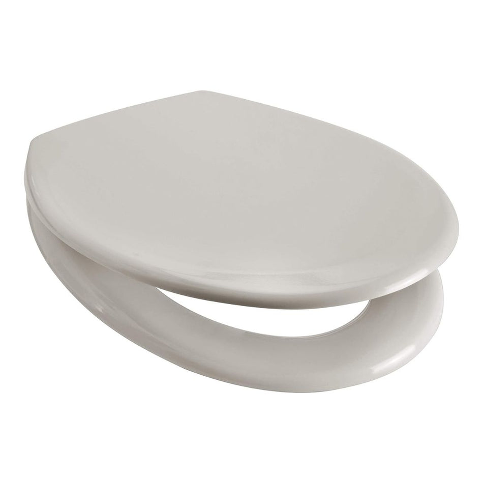 Cream toilet seat with smooth rounded closed lid